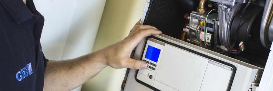 Engineer installing a gas boiler